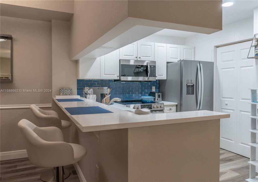 Photo of 2916 Tuscany Ct #201, Palm Beach Gardens, FL 33410 (MLS # A11588662)