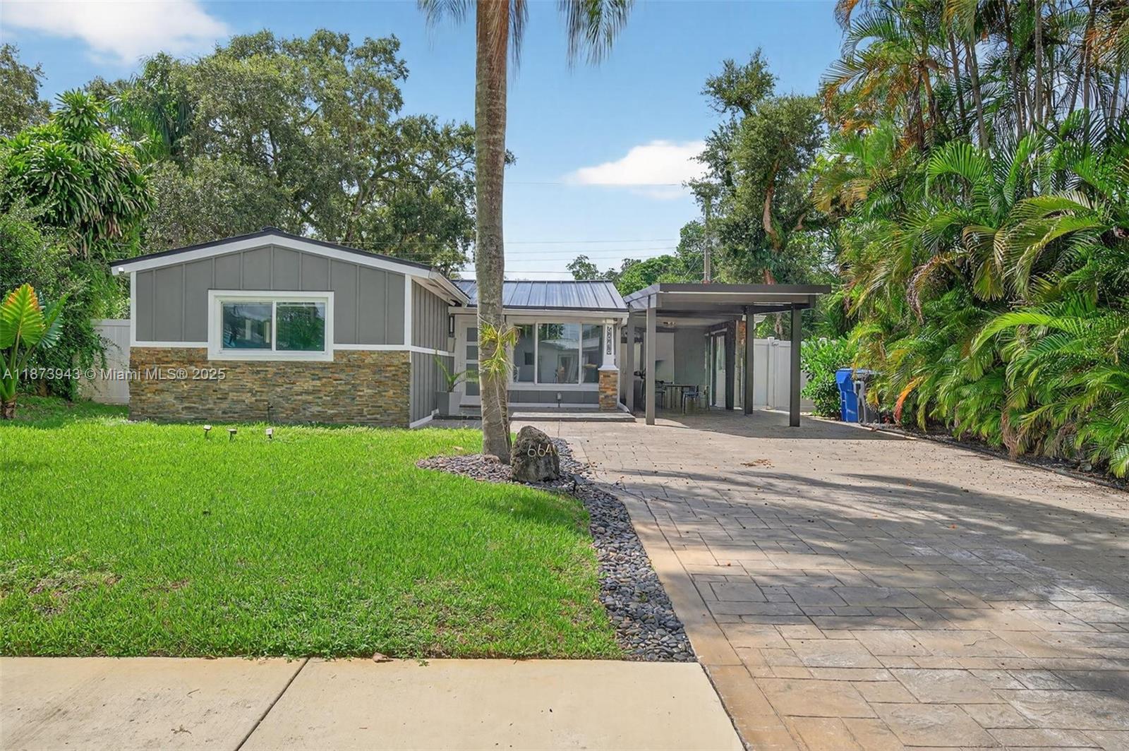 Beautifully remodeled, turn-key home located near the iconic Hard Rock, has stunning night views of the landmark. Just minutes from the Turnpike, beaches, and Publix. Features hurricane impact windows, a brand-new AC system, new roof, new carport, big driveway, new appliances, and a spacious, beautifully landscaped backyard—for relaxing or entertaining.