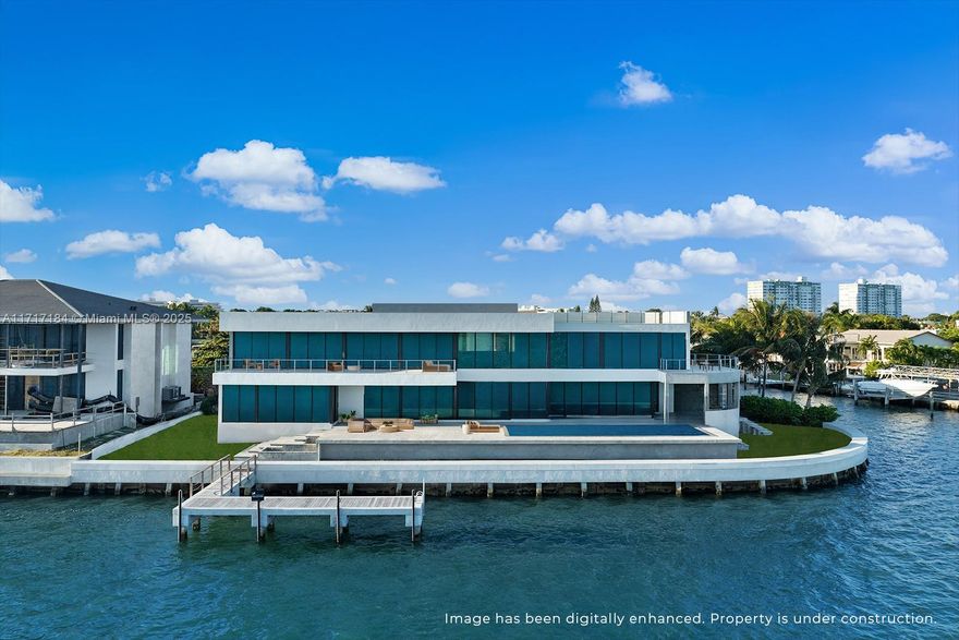 Step Inside With Me! Debuting 11400 N Bayshore, a best-in-class Modern Mansion in gated San Souci Estates with Miami skyline views. Designed by Léo Shehtman, endless walls of glass reveal expansive living spaces with a grand salon featuring 22' ceilings as its centerpiece. The culinary experience by Dell Anno offers sleek cabinetry, central island, oversized pantry and butler's kitchen. A curved architectural staircase leads to the primary wing with TV lounge, marble bath, dressing room & private terrace overlooking Indian Creek Island. A stunning bayfront pool, spa and rooftop setting are divine for hosting. Interiors also include media room, fitness, study, staff quarters. Situated on a cul-de-sac, 16,500+ SF point lot with 217' of unobstructed water views. Ample driveway + 2 car garage.