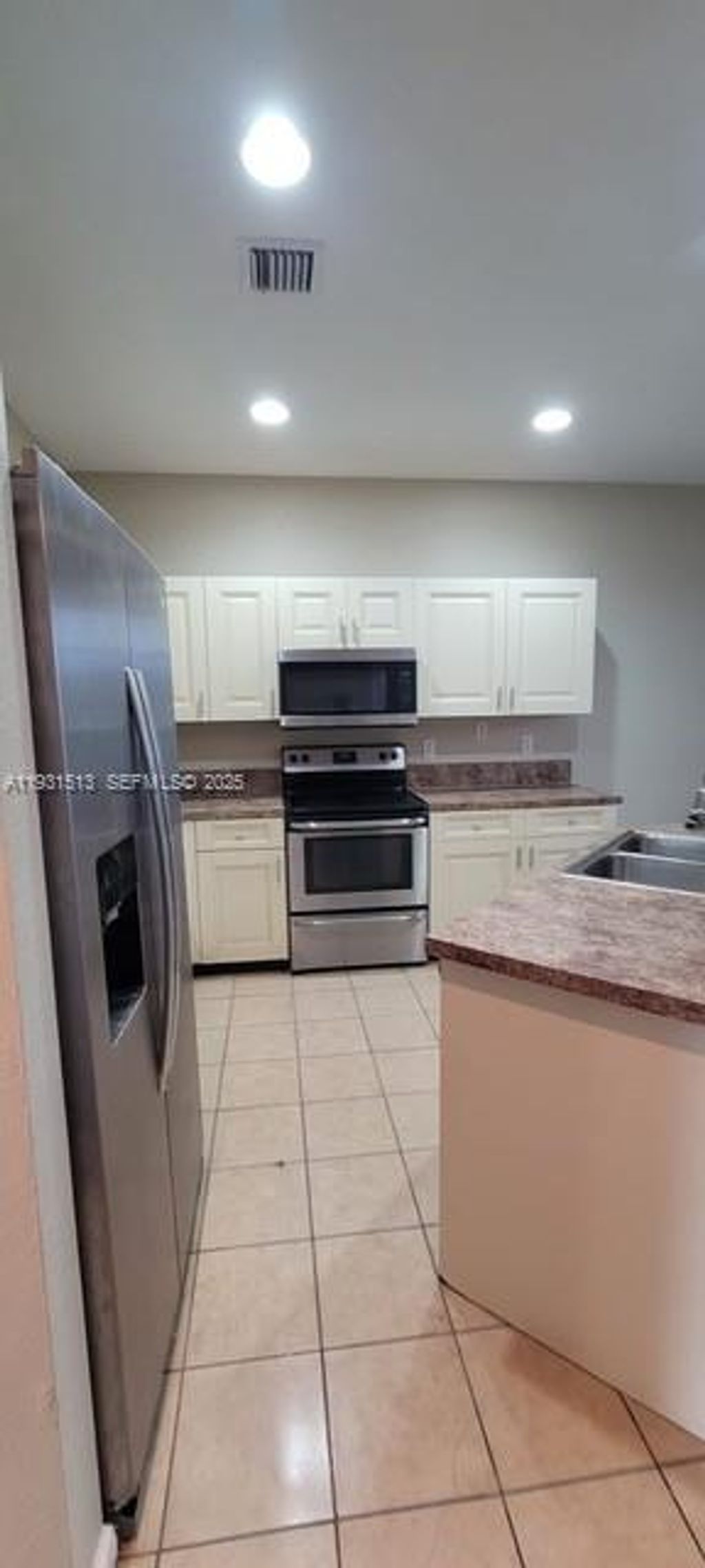 Photo of 1400 LUCAYA Dr, Riviera Beach, FL 33404 (MLS # A11931513)