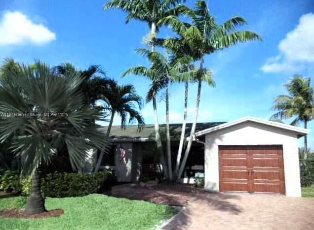 Nicely upgraded home featuring a magnificent pool and patio overlooking a breathtaking waterfront. Enjoy cooking in the gourmet kitchen with wood cabinets, granite countertops, high-end stainless-steel appliances, and a snack bar. This home offers Gas Range, Water Heater, and Home Generator (whole home). Other features include genuine slate floors, vaulted ceilings, crown molding, and a custom built-in entertainment unit. Bathrooms have been recently renovated with modern finishes and freshly painted. Homes is protected with impact glass windows, alarm system, generator, ceiling fans, paver driveway, and lush landscaping for that added curb appeal. Close to major highways for easy commute, many restaurants around the area, shopping malls, hospitals, schools and more.