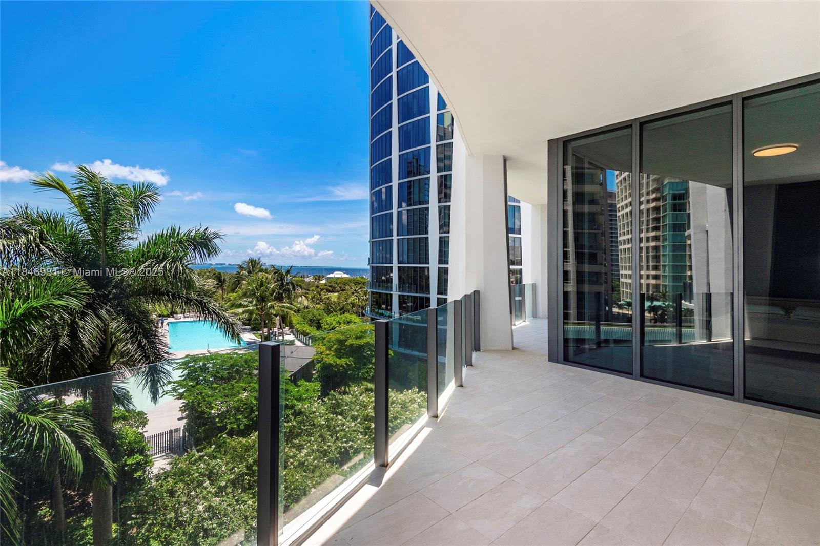 One-of-a-kind residence with private foyer, 12’ ceilings, floor-to-ceiling windows, marble flooring throughout. This 3 bed + den split features 3 bed with private en-suite baths, custom wood details, upgraded Italian kitchen w/marble countertops, premium appliances. Primary suite w/ dual walk-in closets and a luxurious marble bathroom. Park Grove features over 3.5 acres of 5-star amenities: multiple gyms, 24-hour concierge, spa, fitness center, 4 pools w/ cabanas, kid’s room, restaurant, Hotel-like services such as maids service, and in-room dining. Movie theatre, wine room and private curated art gallery, are amongst the things to expect when living there. Includes two assigned side-by-side parking spaces.