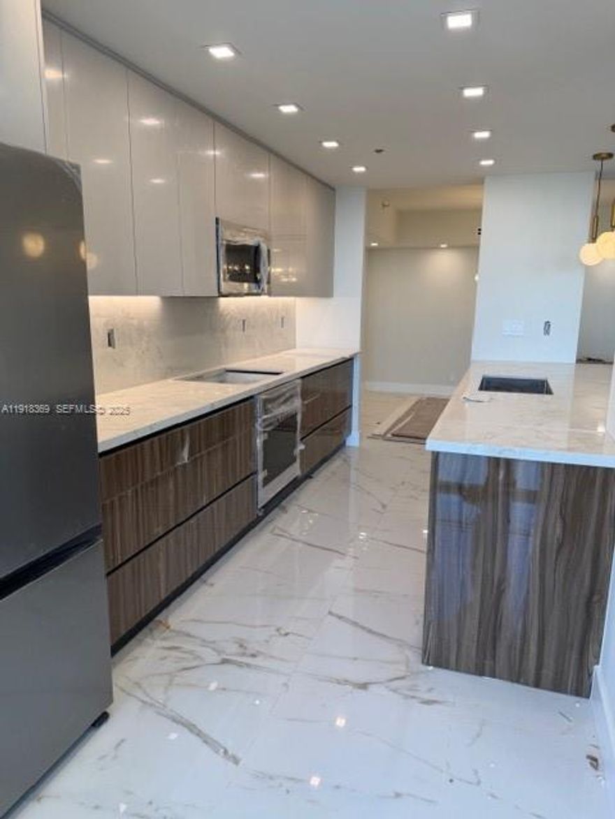 Welcome to luxury lifestyle living at the prestigious Turnberry North tower ,fully renovated one of a kind in  3-bedroom, 2-bathroom, over 1600 with new hurricane windows! This  modern unit features an open floor plan ideal for entertaining, with seamless flow through the living, dining, and kitchen areas,new wood doors, new bathroom and elegant tub in the master bathroom. Enjoy serene Intracoastal and marina views from the brand-new glass terrace. The oversized master suite offers double closets and balcony access. Perfectly located for ACES and Soffer High, with five-star amenities including a heated pool, BBQ, gym, 24-hour concierge, valet, and easy access to Turnberry Golf Course, Aventura Mall, and beaches Building amenities includes heated pool with complimentary towel, jacuzzi, fitness classes, gym, theatre, party/card room, kids room and a restaurant on premises  that can deliver meals to your apartment. Realtors please read input broker remarks!!!!!!!!!