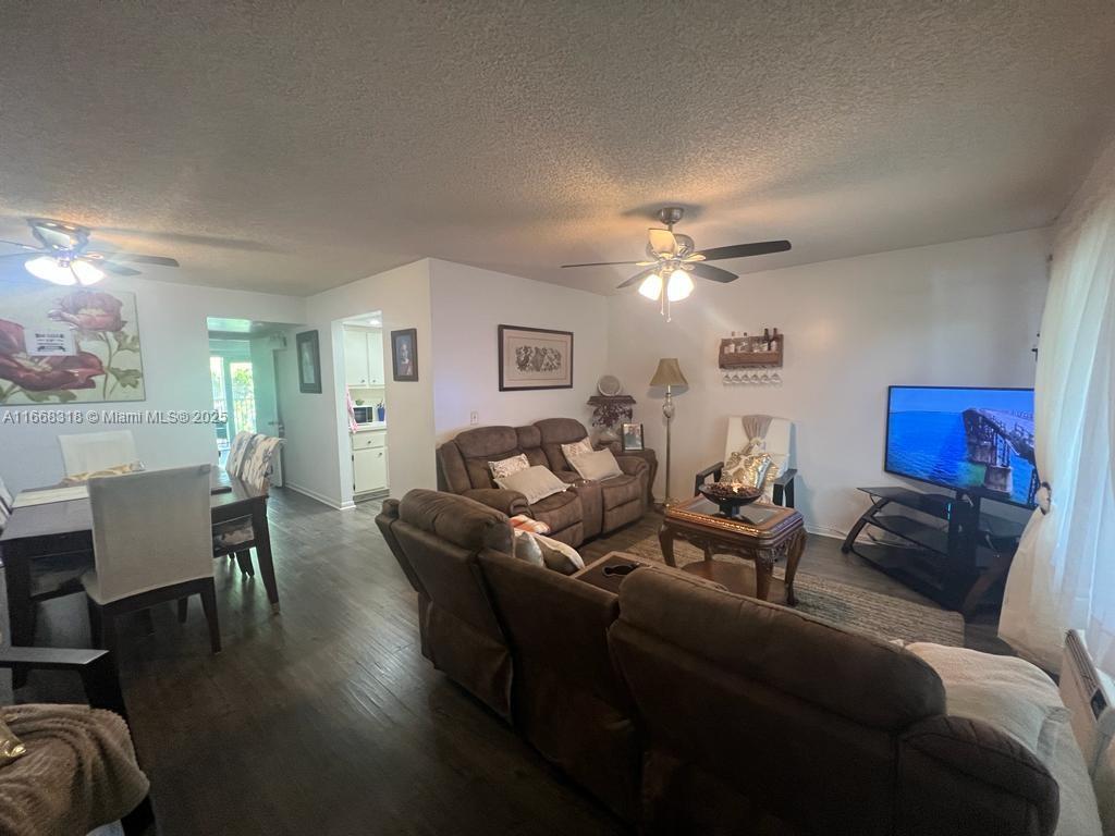 Own a piece of Paradise, in the highly sought after gated community of Century Village. 1b/1.5b condo features a large screened covered balcony, waterproof laminate floors, walk-in closet, hurricane impact windows/door, laundry room located on the same floor, and additional storage space included. Located on the third floor (no elevator). One assigned parking space & plenty of guest parking available. This is a 55+ community with resort style amenities including a clubhouse, transportation, fitness center, 24-hour security, swimming pools, tennis courts, golf, and many more. No Rental Restrictions. THIS HOME WILL NOT LAST!