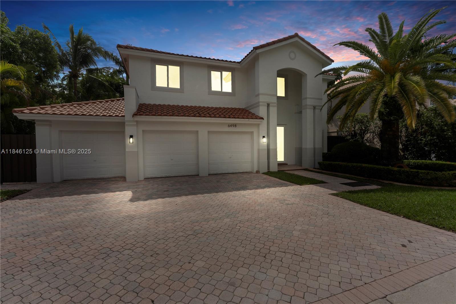Stunning 2-story Home in the prestigious Doral Isles, fully remodeled with top-of-the-line finishes. This 4-bed, 3-bath w Pool features a versatile Den perfect for an office or small room. Nearly 3,000 sq ft of living space with new porcelain tile flooring throughout, LED lighting, and impact windows/doors. The brand-new kitchen boasts quartz countertops, a backsplash, a center island, and high-end appliances. The luxurious master suite offers two oversized walk-in closets and a spa-like bathroom with a Roman tub and dual sinks. Enjoy a private backyard with a pool, a covered area for outdoor entertainment, and space for a summer kitchen. 3-car garage plus driveway for 3 more cars. Doral Isles offers world-class amenities: clubhouse, pools, gym, tennis, and more! Call for a tour today!
