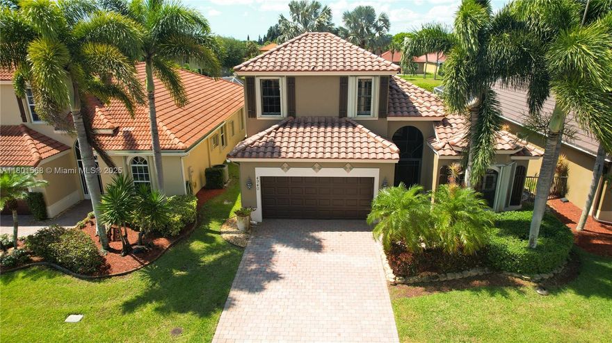 Welcome to this stunning two-story single-family home, with 5 bedrooms and 4 full bathrooms, this 2,439 sq ft residence built in 2005 is ideal for buyers seeking a convenient lifestyle.
High ceilings and elegant crown molding create a bright, open feel throughout the home. The primary suite is located on the first floor and offers two walk-in closets, a spa-like bathroom with a Jacuzzi tub. 
Enjoy lake views from your backyard oasis, complete with a private pool. Inside, plantation shutters add charm and privacy, while hurricane accordion shutters provide peace of mind.
The gourmet kitchen features black granite countertops, stainless steel appliances, and maple cabinetry. 
Gateway Gardens residents enjoy access to tennis courts, a playground, and beautifully maintained common areas.