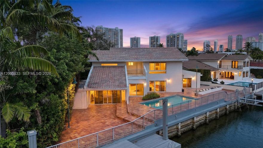 Rare opportunity to secure 126 feet of direct water frontage in a gated cul-de-sac — ideal for building a custom luxury estate. Priced under appraised value and ready to sell, this oversized lot offers exceptional potential in one of the area’s most desirable waterfront pockets.
Located minutes from Sunny Isles, the beaches, and Aventura Mall, the property delivers both privacy and prime accessibility. With expansive water views and generous frontage, it presents the perfect canvas for a modern showpiece with dockage and resort-style outdoor living.
The existing 4-bedroom, 3-bath residence features a pool, private dock, and open layout, offering immediate usability, rental potential, or a holding option while planning redevelopment.
Seller financing available for qualified buyers. Waterfront parcels with this level of frontage and location are increasingly rare — build your vision here.
