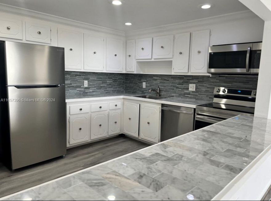 Beautifully renovated floor plan 2/2 apartment with great views. There is one primary suite, another large 2nd bedroom. Renovated tile floors throughout, flat ceilings, modern open kitchen with new cabinets, counter tops and
stainless steel appliances, new bathrooms floors and balcony with city views. Apt can be rented right away. 24
hours security, laundry facilities, pool, storage and covered parking. Excellent location close to Aventura, I-95,
located close to FIU, Johnson and Wales, Berry University, a short distance from Parks, Malls, and Restaurants and
only a short drive to the Beach. Right on BISCAYNE BLVD Across Street from Starbucks, Banks, Restaurants and
minutes from Costco, Publix and the beaches. Make it your home or a great opportunity for Investors.
