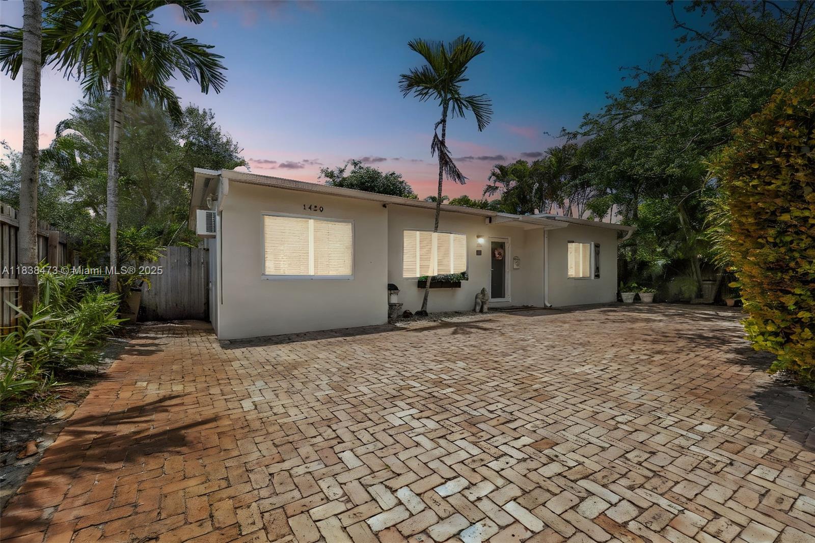 Must see this, updated 3 bedrooms and 2 bathrooms single family home in excellent neighborhood of Poinsettia Heights. As soon as you walk in the door, you feel that you're right at you're home. This beautiful and cozy home is on a quiet street and features: natural Oak Wood flooring, Impact Glass doors/windows, Brick Paver Driveway, newer kitchen w/Wood cabinetry, granite countertops, stainless steel appliances, Florida room overlooking large deep lot with room for pool, fenced yard and lush landscaping! Perfect home for entertaining! 400 SF screened-in patio with roof, wet bar & hot tub. Close to everything like Trader Joe's, Publix, Downtown, Las Olas, beaches, and more!!