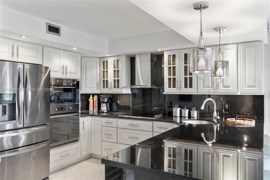 TOP OF THE LINE CONDO ! Located directly on the water and across from the Diplomat Golf Course, it offers breathtaking views and serene surroundings. The split-model 2 beds / 2 baths has been meticulously remodeled with high-end finishes, featuring an open kitchen, tiled bathrooms with custom-made vanities, electric shutters, and custom doors. Plus, it comes with brand-new, high-end furniture! Relax on your large sunny balcony and take in peaceful golf views. The community boasts two heated pools, a sauna, & a fitness center! With its prime location in the heart of Hallandale, you're just steps away from the beach, shops, and restaurants. Best of all, this is a turnkey unit, ready for you to move in and start enjoying the good life!