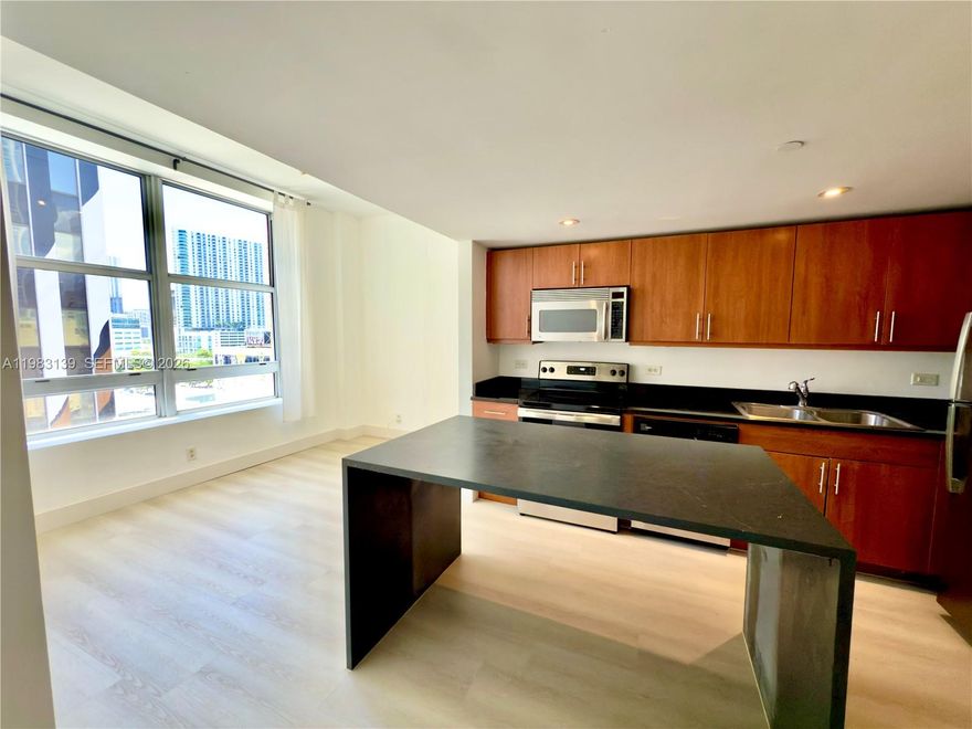 Rented, income producing turn-key investment property in the heart of Downtown Miami! Welcome to your dream urban retreat. This two bedroom condo offers the perfect blend of modern luxury and vibrant city living. Step inside and be greeted by an open-concept, fully remodeled space featuring a spacious island, perfect for cooking or casual eat in dining. Enjoy the convenience of an in-unit washer / dryer, modern appliances, brand new water heater and central air conditioning to keep you cool year-round. Expansive windows fill the space with natural light and city skyline views. This cozy, well cared for condo is steps away from the Kaseya Center & Miami's finest dining, shopping & entertainment. This is the best priced 2 bedroom in the area, perfect for investors looking for a low maintenance income property or owners ready to live in the mix.