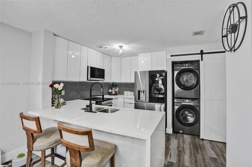 Stunning fully upgraded 2 Bedroom townhouse in the highly sought-after Vizcaya community! This move-in-ready home features two spacious master bedrooms, perfect for privacy and flexibility. The modern kitchen showcases sleek white acrylic cabinetry, top-of-the-line stainless steel appliances, and a clean, contemporary design. Beautiful gray LVP flooring flows throughout the home, creating a cohesive and stylish look. Both bathrooms have been fully upgraded with elegant porcelain tile finishes. Enjoy your own cozy private patio, perfect for relaxing or entertaining. Peace of mind with a newer bigger AC unit. Located next to Somerset Academy, consistently ranked among the top schools in South Florida. Ideally located in the heart of Miramar, just minutes from the Florida Turnpike and I-75, offering unbeatable convenience for commuting and daily living. This is truly the best listing in Vizcaya with super low HOA fee $200—don’t miss this rare opportunity! It won't last!!!!