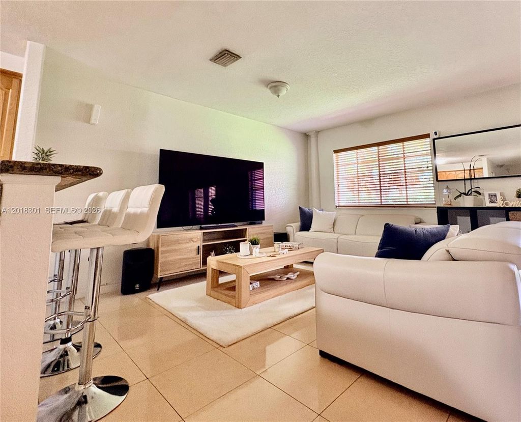 Photo of 9020 NW 38th Dr #5, Coral Springs, FL 33065 (MLS # A12018301)