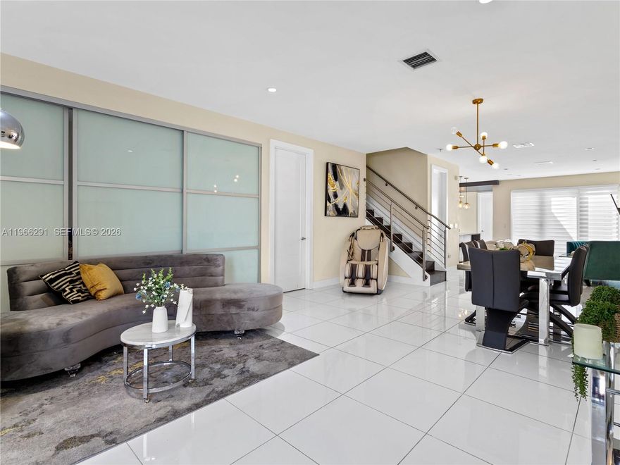 Priced to sell FAST — don’t miss your best chance in Doral. This immaculate turnkey tri-level luxury townhome (2,698 SQ FT) is move-in ready with window treatments, closets, newer appliances, smart toilets, TVs and lighting included. Bright, modern open layout with oversized impact windows, chef’s kitchen, flexible enclosed den/office and a full entry-level bath. Large laundry, smart built-ins and an enclosed 2-car garage with EV charger plus two exterior spots. Upstairs: three private bedrooms and 2.5 baths. The rooftop double terrace is the crown jewel—semi-covered, fully private with a summer kitchen and built-in BBQ for unforgettable Miami evenings. Premium upgrades (hot tub, cold plunge, sauna, furnishings) may be included with competitive offers. Steps from top schools, shopping and dining. Immediate occupancy — exceptional value and rare features. Act now and schedule your showing before someone else does.