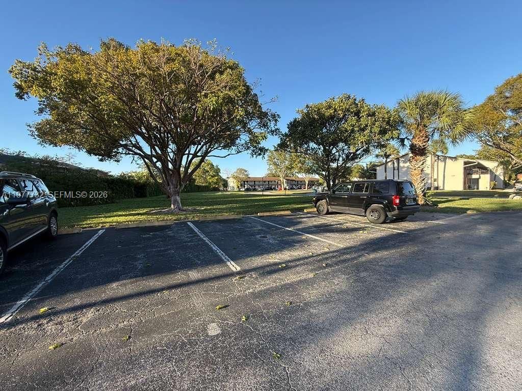 Photo of 6031 Shakerwood Cir #201, Tamarac, FL 33319 (MLS # A11977732)