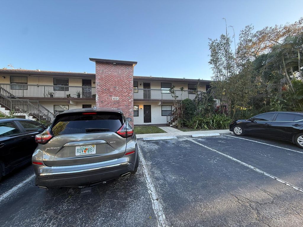 Photo of 6031 Shakerwood Cir #201, Tamarac, FL 33319 (MLS # A11977732)