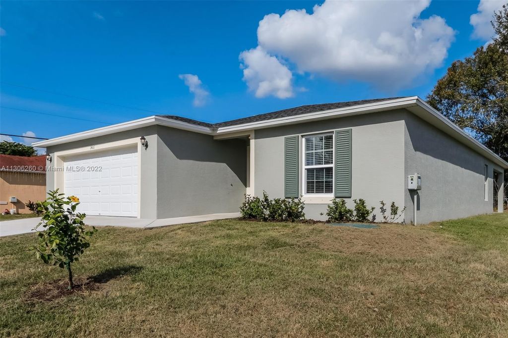 Photo of 1401 SW Goodman Ave, Port Saint Lucie, FL 34953 (MLS # A11306260)
