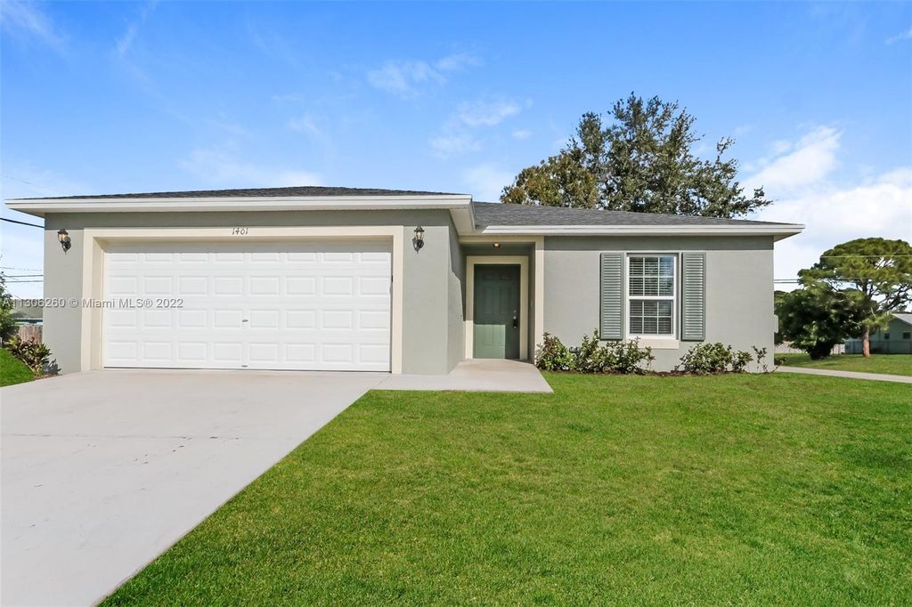 Photo of 1401 SW Goodman Ave, Port Saint Lucie, FL 34953 (MLS # A11306260)