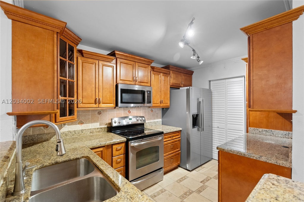 Photo of 11229 W Atlantic Blvd #108, Coral Springs, FL 33071 (MLS # A12034002)