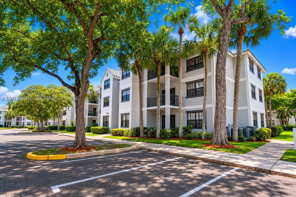 Photo of 11229 W Atlantic Blvd #108, Coral Springs, FL 33071 (MLS # A12034002)