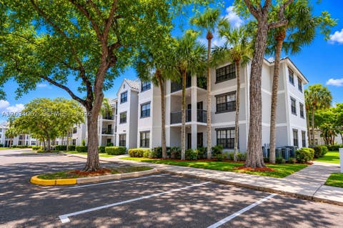 Photo of 11229 W Atlantic Blvd #108, Coral Springs, FL 33071 (MLS # A12034002)
