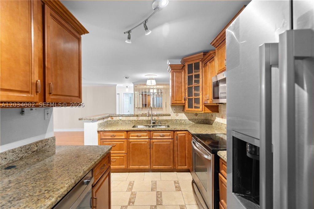Photo of 11229 W Atlantic Blvd #108, Coral Springs, FL 33071 (MLS # A12034002)