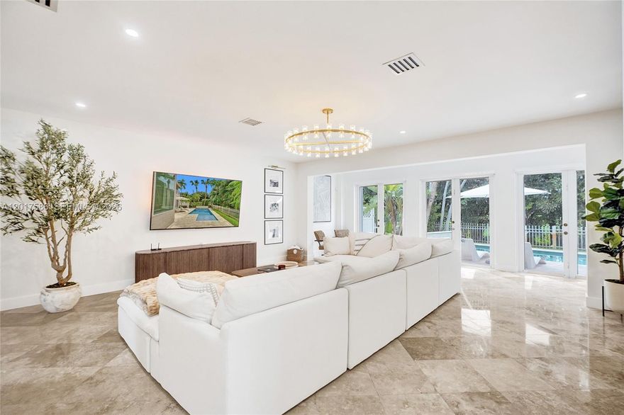 Located in the highly sought-after Doral Dunes community, this beautifully maintained two-story home is truly one of the finest residences in the neighborhood. Offering 4 bedrooms, 2.5 bathrooms, a private pool, and energy-efficient solar panels, the home seamlessly blends comfort, style, and thoughtful upgrades throughout. Designed for both everyday living and effortless entertaining, the main level features polished marble floors, spacious living and dining areas, and a stunning remodeled kitchen with soaring 13-foot ceilings, oversized windows, large center waterfall island, and a gas range. Upstairs, you will find three generously sized bedrooms and two bathrooms, including a recently redesigned primary bath completed to stunning designer specifications. The private backyard feels like a tropical retreat, featuring lush landscaping, fruit trees, salt water heated pool, and exceptional privacy with a serene setting behind the golf course. Additional highlights include a new roof installed in June 2024, Tesla charger in the two-car garage, two new AC's and all new air ducts upstairs. New gutters installed.