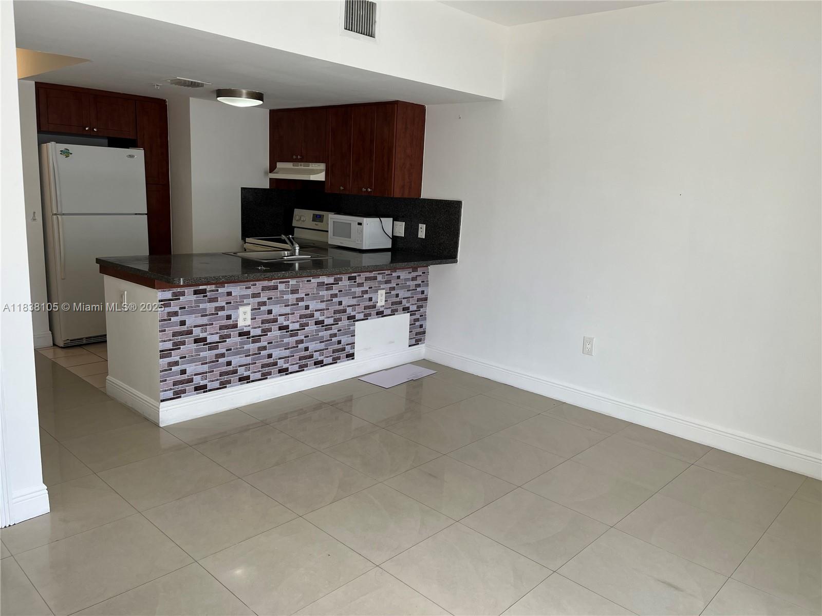 This two-story unit features 2 beds, 2 bath, high ceilings, balcony, and impact windows. It is situated in a gated building and includes 2 allocated parking spaces. The location is just west of Downtown Miami and only 1 mile from Brickell. Little Havana is the hub of Cuban culture in Miami with Calle Ocho, the main commercial thoroughfare, showcasing restaurants, specialty shops, art galleries, and dance halls in vibrant, colorful buildings. The Latin Walk of Fame is also a must-see attraction.