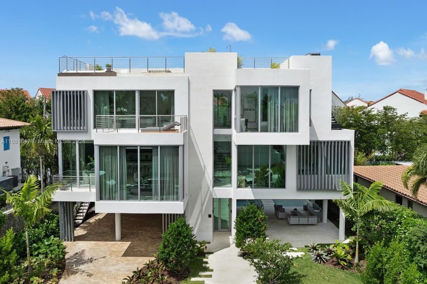 This stunning new construction in Coconut Grove showcases modern organic sophistication. Nestled in the highly desirable Coconut Grove area and just steps from the bay, this home boasts four generous bedrooms, four and a half bathrooms, 10’ high ceilings, and abundant natural light from floor-to-ceiling impact windows. The added convenience of an elevator enhances accessibility throughout the residence. The outdoor space is equally impressive, featuring a sparkling pool on the ground floor and a rooftop jacuzzi with bay views—perfect for enjoying spectacular sunsets and sunrises. Located just 5 minutes from Brickell/Downtown and the heart of Coconut Grove, it provides easy access to both urban conveniences and vibrant city life.