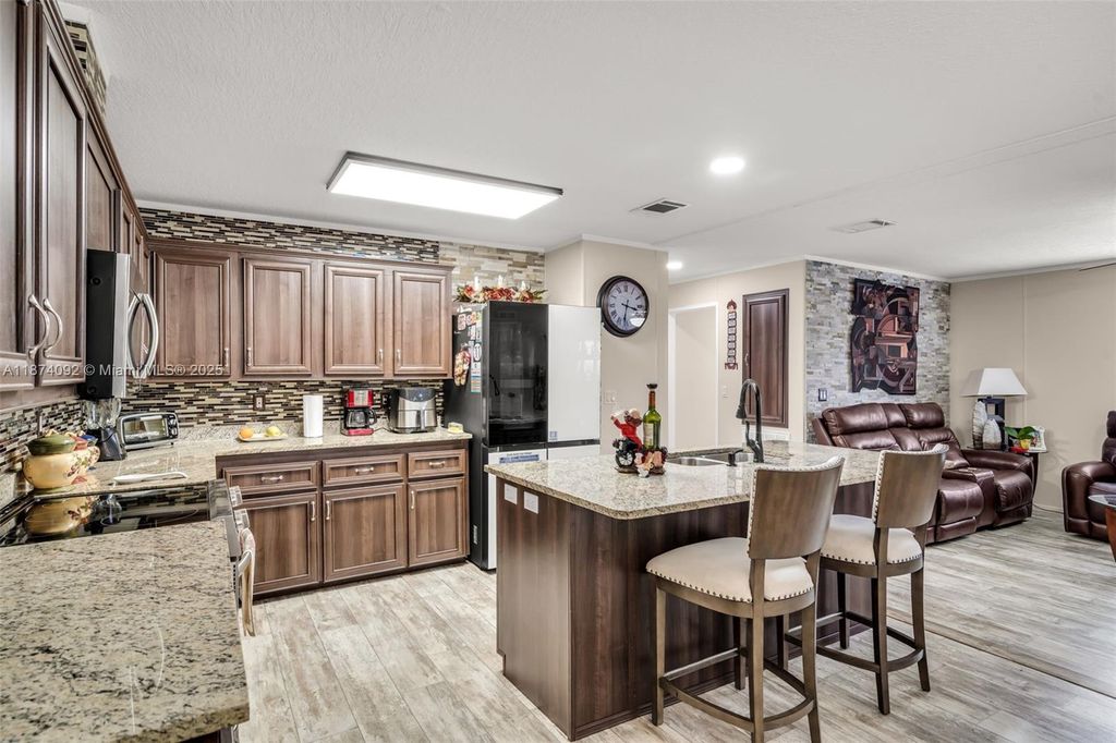 Photo of 12850 W State Rd #1 Gardenia Ln, Davie, FL 33325 (MLS # A11874092)