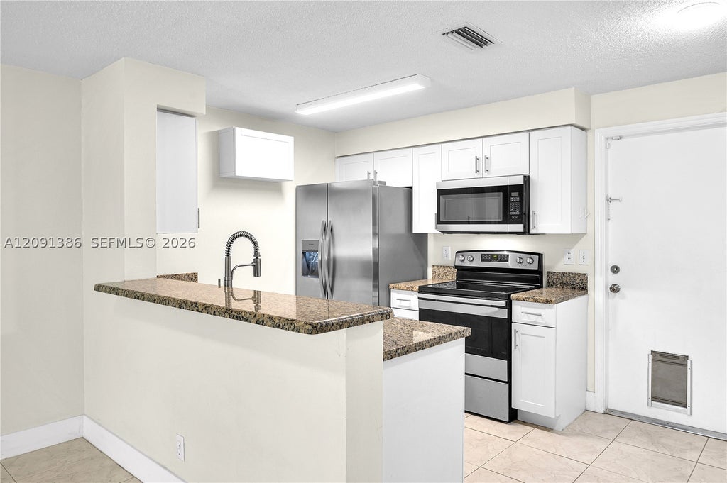 Photo of 621 Talavera Rd #621, Weston, FL 33326 (MLS # A12091386)