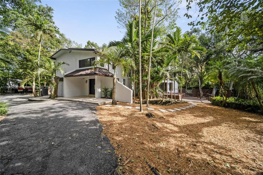Mid Century Modern home in Pinecrest on large lot. Home is in unique Devonwood neighborhood, giving you a tropical Coconut Grove like feel, with the privacy of a 26,000 sqft lot, and safety of the Pinecrest Village. Easy to Show, just call agent for instructions.