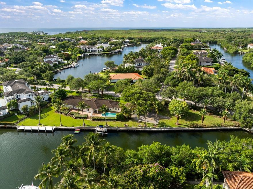 A distinguished trophy property boasting the largest waterfrontage, featuring 363 linear feet on the bay with direct Ocean Access in the prestigious Old Cutler Bay community. The expansive 29,838 SF lot with 363-foot seawall capable of handling 100+ vessels, nestled on the wide private serene basin overlooking Gables Estates. Features include 58ft dock with PVC decking, updated concrete seawall and boatlift with 10,000lb capacity. Build your dream home or move into updated 5BD/3BA pool home with CGI impact windows/doors, formal liv/din/fam rooms. Conveniently located near Miami's top private and public schools, as well as premier dining, shopping and entertainment options.