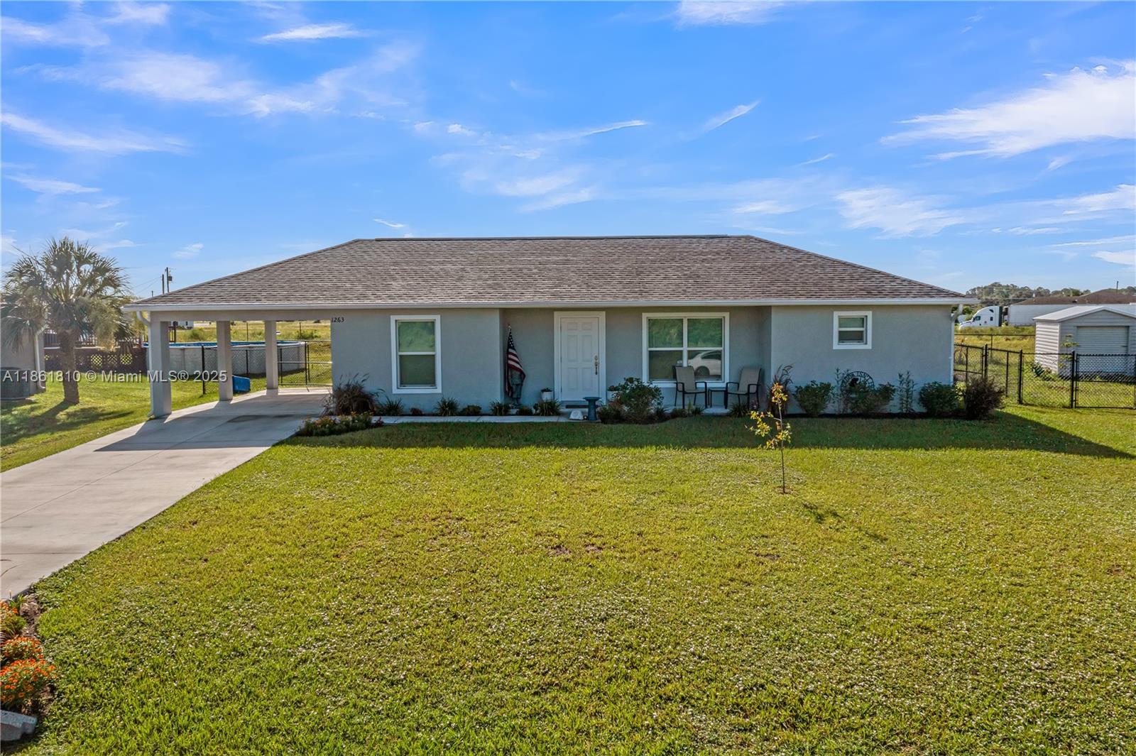 LIKE NEW CBS 2/2 FENCED BACKYARD & CARPORT GREAT LOCATION IN THE GLADES COUNTY AREA OF PORT LABELLE NEAR THE PORT LABELLE RANCHETTES! Coveted Beck-built concrete block home, built in 2021 and still like new with luxury vinyl flooring throughout and brand-new upgraded KitchenAid appliances including a double-oven stove, super-quiet dishwasher and French door refrigerator. The separate laundry features a Samsung washer and dryer. Home is designed with a split bedroom and bathroom floor plan. Home has a convenient carport, and a black chain link fenced backyard. Located in the West Glades School district (K thru 8), a Grade A school. This location is convenient to both Clewiston and LaBelle, and is NOT in a flood zone.