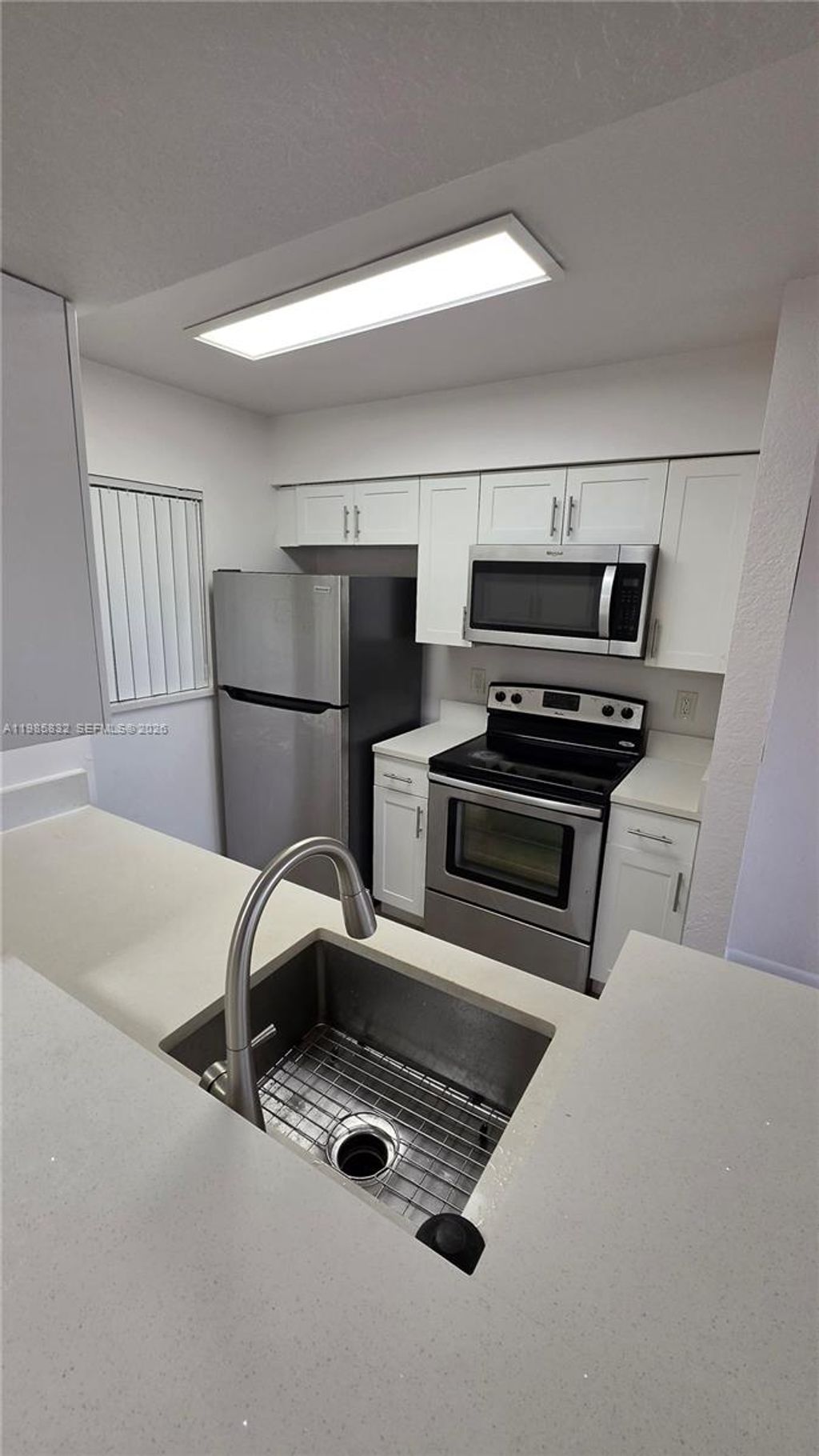 Photo of 2881 N Oakland Forest Dr #210, Oakland Park, FL 33309 (MLS # A11985832)