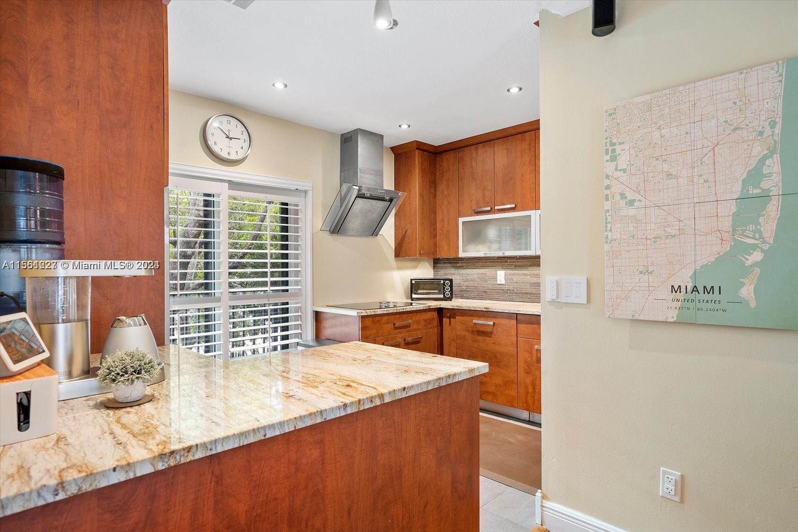 Gorgeous 2BD/2.5BA townhome in the intimate community of Bridgeport Villas in desirable Coconut Grove. The unit features: smart home lights & thermostat, Fiber internet, a gourmet kitchen with stainless steel appliances, spa-like bathrooms with beautiful travertine marble, hardwood floors, crown molding, 6" baseboards, NEW A/C, custom plantation shutters, impact & insulated windows, & hurricane shutters. W/D in the unit. This unit has an adt'l storage room. Gated private community, carport(2), patio, spacious community pool. Each floor has a balcony. If you're looking for a peaceful, well maintained, relaxing community with the small town vibe and all the benefits of a big city, you'll love this exceptional home. Available furnished as well.