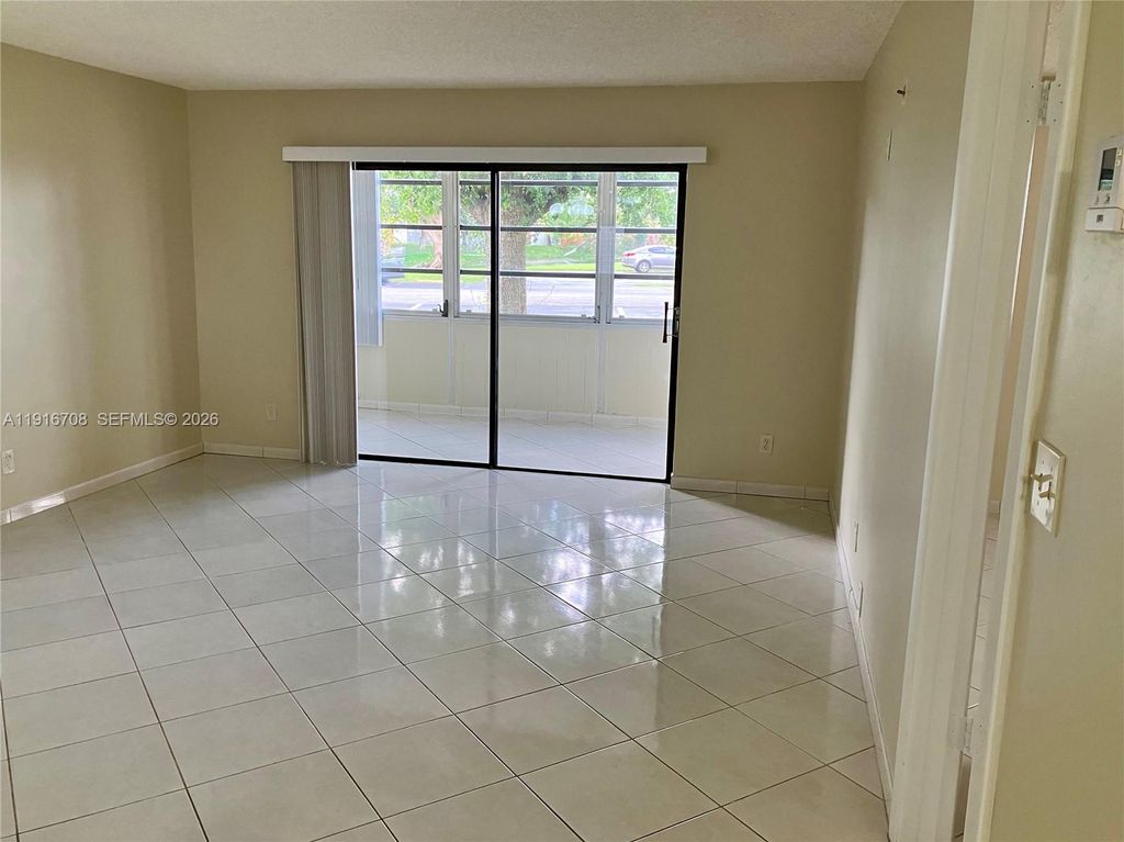 Photo of 4270 NW 40th St #103, Lauderdale Lakes, FL 33319 (MLS # A11916708)