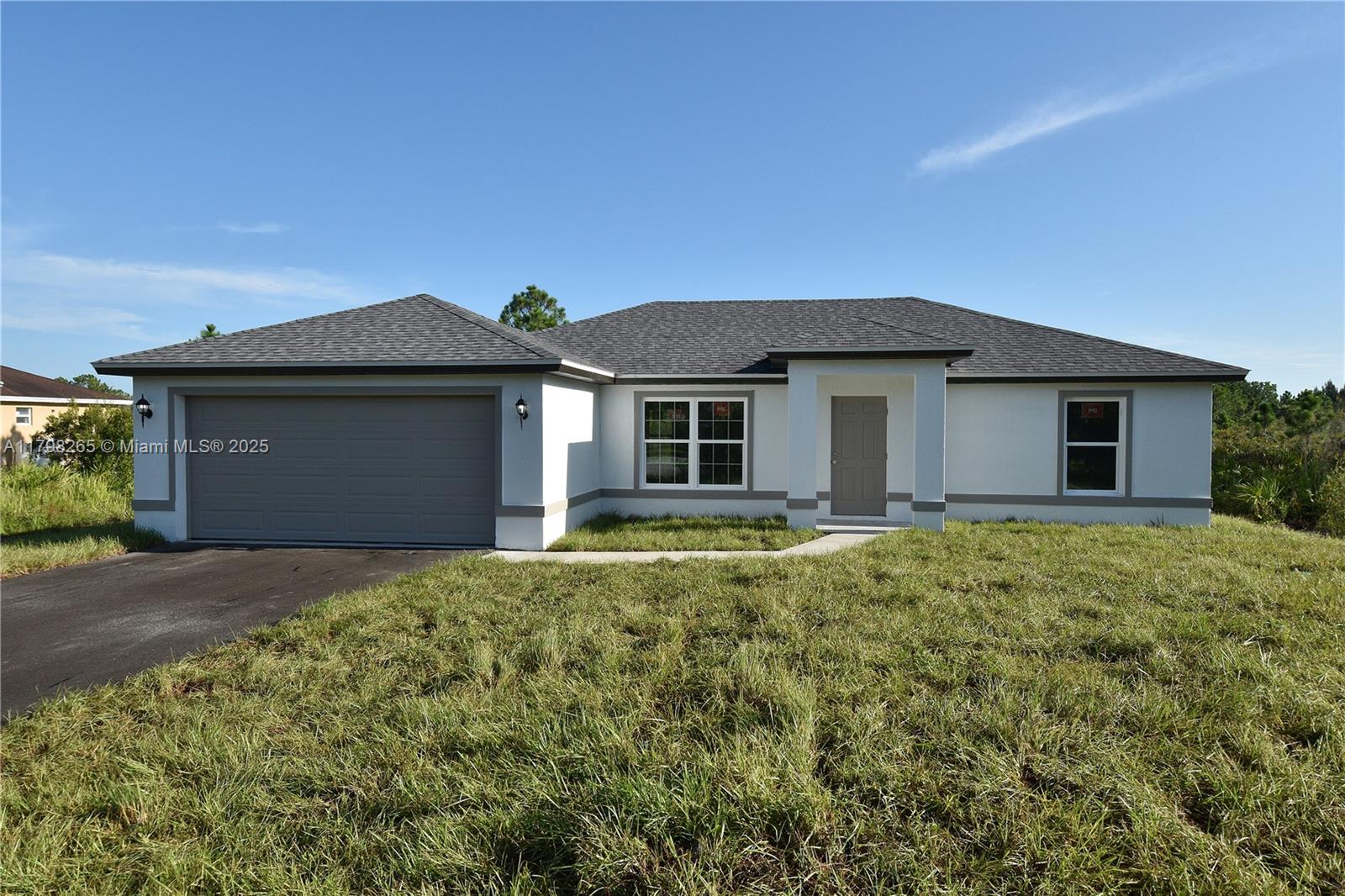 New construction Home located in the northern area of Golden Gate Estates. This cozy 3 Bedroom Two bathroom is built on a 2.27 acres lot, plenty of space to move around! Features a two car garage, split bedroom design, combination tub and shower and wall tile at bathrooms. Lanai enclosed with screen. Paved, public access road. Close to the Seminole casino hotel; Collier county fair grounds; Big Corkscrew island regional park and soon to be available retail and commercial at Winchester Center.