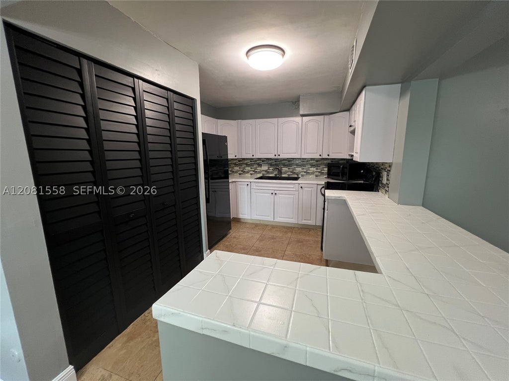 Photo of 1854 SW 81st Ter #6-17, Davie, FL 33324 (MLS # A12081558)