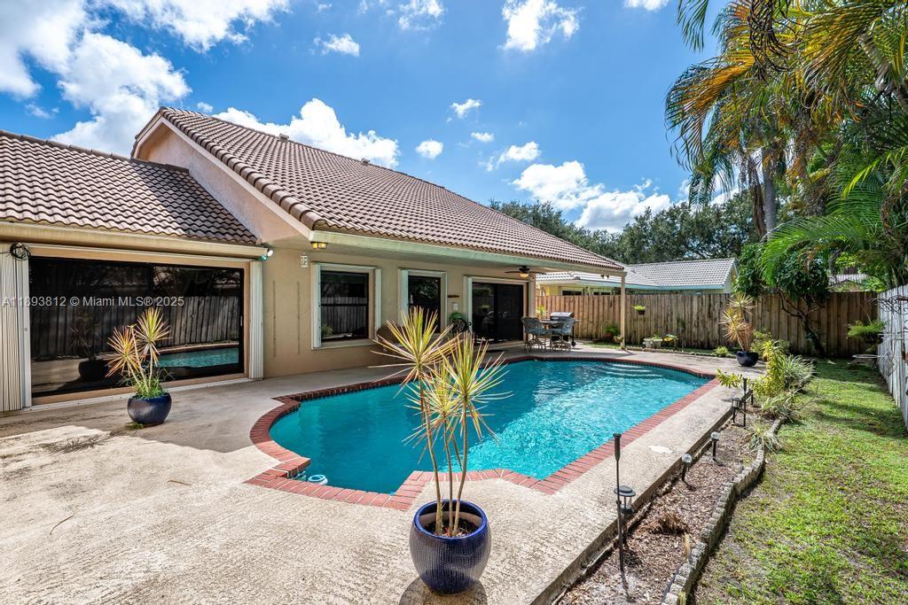 Lovely 4/3.5 Pool home in the heart of Plantation, French doors open in to the grand formal living & dining room areas. Chef's Kitchen offering lots of cabinets, granite counters & stainless steel appliances. Enormous room
with breakfast area & a separate bar adjacent to the kitchen. Separate Laundry room with storage space. Primary suite complete with his & her closets, spa like bathroom & sliding doors over looking the pool area.
Spacious secondary bedrooms with ample storage & closet spaces. It has several cameras for a surveillance system. Mango, avocado and papaya fruit trees. Excellent location close to shopping. Restaurants, supermarkets, hospital, Sawgrass Mills Mall, Panther's Arena & Highways.