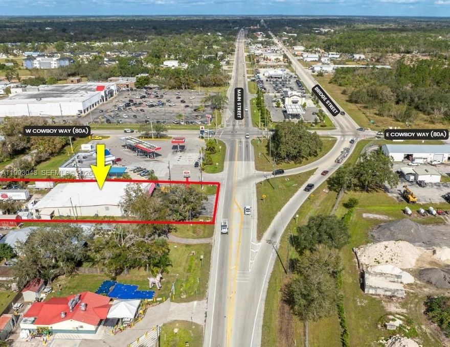 PRIME LOCATION IN BETWEEN WINN-DIXIE AND HELMS ROAD EXTENSION IN PATH OF PROGRESS! The facility consists of a 7,500 sq. ft. steel building with a 1,050 sq. ft. addition. The building boasts a new metal roof (installed in 2023) and new acrylic finished flooring. The property site is .578 acre with 100' on State Road 29 S. Front of the building features asphalt parking area and open canopied front porch for display purposes; back of building is situated on Luckey Street, providing rear access plus the current workshop and repair area including Ted's shed. Zoning is C-3, offering many commercial uses. Property is in Hendry County, but is serviced by City water. The building is open with center offices which can be easily removed or relocated and has some loft storage.
