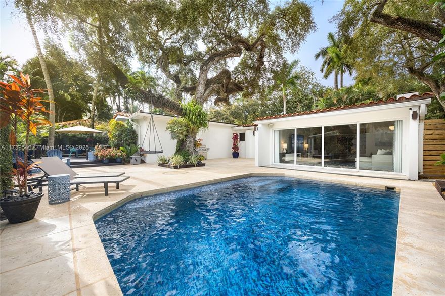 Behind a walled & gated entrance on a quiet North Grove cul-de-sac, this stunningly redesigned single-level residence combines privacy, modern luxury & an unbeatable location. Floor-to ceiling glass floods the interiors w/natural light and open to a newly renovated pool & patio. The sleek Italian kitchen is a chef’s dream w/high-end Wolf & Subzero appliances, a 180-bottle wine cooler+ custom built-ins. Vaulted ceilings, designer lighting, white iceberg marble + hardwood flooring & refined finishes throughout - enhance the sophisticated atmosphere throughout the home. The flexible floor plan has a seamless flow & includes a 3BR/3.5BA main house + a detached 1BR/1BA guest casita. Just steps away from top schools, local cafés & Biscayne Bay- this home offers the best of Coconut Grove living.