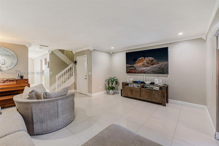 Move-in ready and beautifully remodeled corner townhome in Hialeah featuring 3 bedrooms and 2.5 baths. The recently updated primary bathroom and spacious walk-in closets add comfort and functionality, while porcelain flooring on the first floor and vinyl flooring on the stairs and second level create a modern, cohesive look. This clean, well-maintained home has been freshly painted inside and includes impact windows, two designated parking spaces, and additional guest parking. Enjoy outdoor living in the large private patio with convenient storage space. The A/C has been recently maintained, the roof is approximately 8 years old, and the property is located in Flood Zone X for added peace of mind. The gated community offers 24-hour security, three swimming pools, a playground, and basketball courts. HOA is $372/month and covers exterior insurance, roof, landscaping, and common areas. Owner-occupied—24-hour notice required for showings. Ideally located near shopping, supermarkets, and dining, with easy access to major highways and top nearby schools including Mater Academy Charter School, José Martí MAST Academy, Ernest R. Graham K-8 Center, and West Hialeah Gardens K-12, all within approximately two miles.