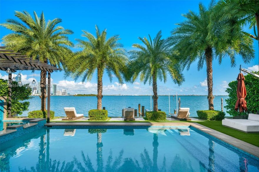 PRICE ADJUSTMENT. Reduced by $1.5M. Seller Will Entertain Reasonable Offers! This Gated Waterfront Home is a classic design located on a Venetian lsland dead-end street. Enjoy the ultimate Miami lifestyle with unobstructed north wide bay views and the Miami Skyline. With 65’ Open Water Frontage, the private dock can accommodate 2 boats. This 7 bedroom, 7.5 bathroom + Home Office is just under 6000 SF of indoor living space on a 9100 SF lot. There is a gracious living room / dining room and a large kitchen / family room. The primary bedroom suite is approx. 1000 SF with a large walk-in closet and a private balcony. Marble floors run throughout the house. The spacious outdoor living space includes a heated pool, jacuzzi, outdoor kitchen and dining room plus a separate entertaining area.