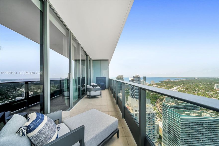 PH 5807 is now available for lease. This corner 3BR, 3.5BA residence is fully furnished by Restoration Hardware and features 10' floor-to-ceiling windows with unobstructed Biscayne Bay and skyline views from its high-floor vantage point. The open layout includes a chef’s kitchen with Miele appliances and thoughtfully designed living spaces. A split-bedroom floor plan provides privacy and flexibility of use. Additional features include specialty wall coverings, walk-in closets, and automated shades throughout. Includes 3 parking spaces (2 assigned + 1 valet). Located in the heart of Mary Brickell Village, residents enjoy a rooftop pool, spa, fitness center, and 24/7 concierge. Fully furnished and completely move-in ready for immediate occupancy. Also for sale A11911097.
