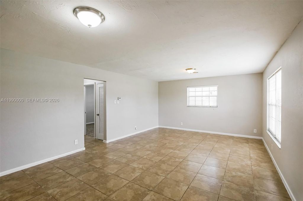 Photo of 5961 NW 14th Ct, Sunrise, FL 33313 (MLS # A11990000)