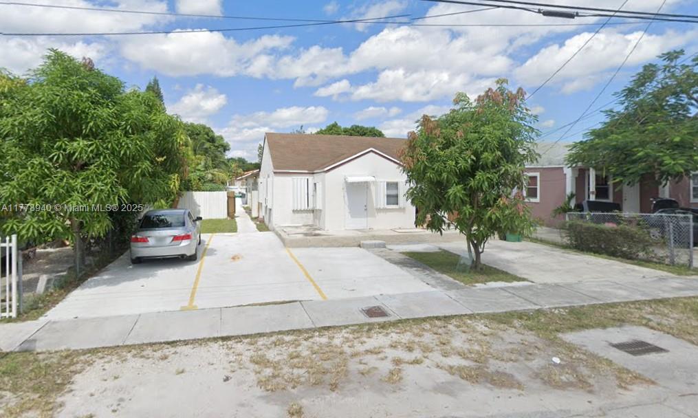 2,150 SQFT LIVING. TOTAL $6,600 RENTAL INCOME. This home is divided into 3 units but can EASILY BE converted back to a 1 single-family unit. Currently divided as 3 beds/1 bath (rented at $2400/m), 2 beds/1 bath (rented at $2300/m), and 2 beds/1 bath (rented at $1900/m). The expansive driveway can fit about 7 cars. Hurricane shutters throughout. One of the units has wall AC, and the other 2 units have central AC. On a septic tank. No washer and dryer. Centrally located near I95, shopping centers, and restaurants.