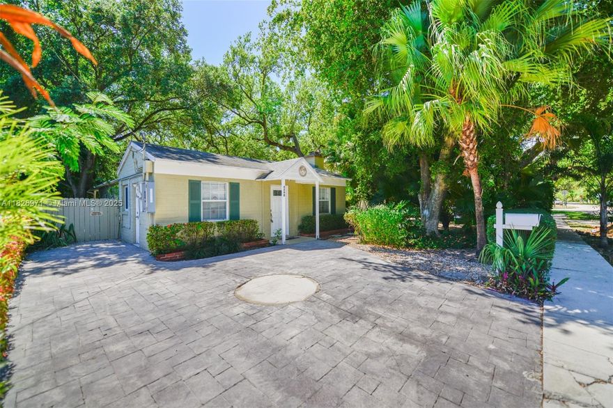 Enjoy living in the heart of South Miami, tucked away on a quiet, one-way street and surrounded by lush landscaping, including beautiful oaks and swaying palms. This timeless cottage home has been tastefully updated and is ready for immediate move-in.
Step inside to a warm and inviting living room with a decorative fireplace, an upgraded open-concept kitchen, three comfortable bedrooms, one full bathroom, and a versatile den—perfect for a home office or guest space. The expansive backyard patio offers a private retreat, ideal for relaxing or entertaining outdoors.
Conveniently located close to top-rated schools, shopping, hospitals, dining, public transportation, and more, this home blends charm, comfort, and an unbeatable location