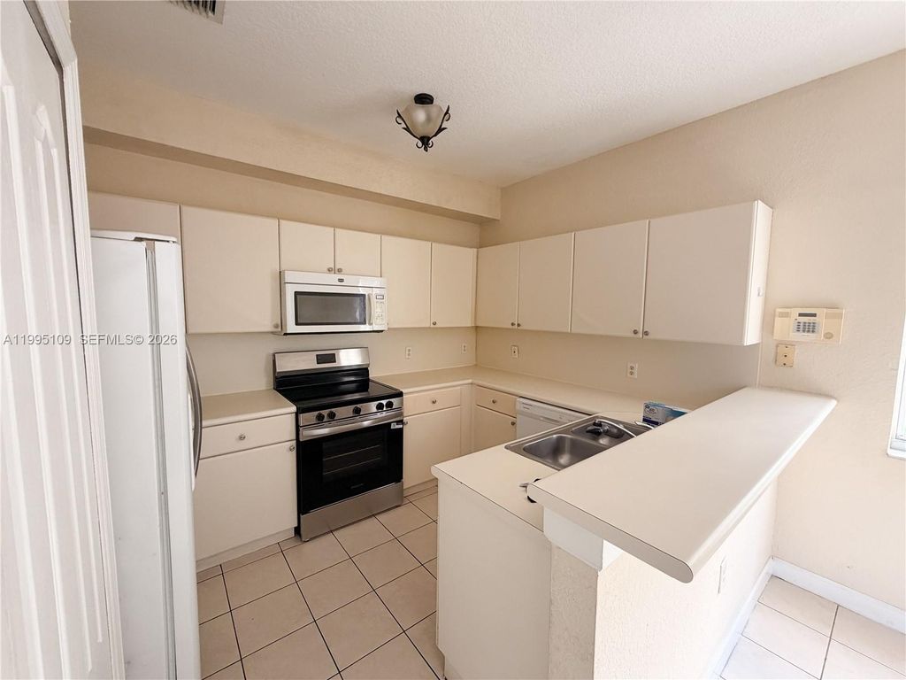 Photo of 2039 Shoma Dr #2039, Royal Palm Beach, FL 33414 (MLS # A11995109)