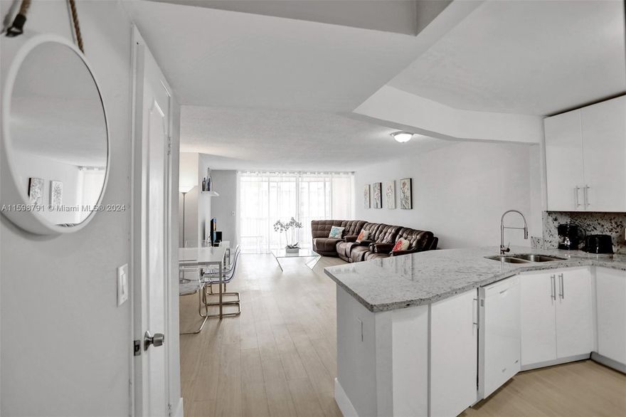 WOW! LIGHT & WHITE REMODELED LARGE 2 BED 2 BATH GEM. OPEN MODERN WHITE KITCHEN WITH GRANITE COUNTERS, EXTENDED BREAKFAST BAR, AND PANTRY. NEW PLUMBING & ELECTRIC. MODERN NEW BATHS WITH FLOATING VANITIES & HIDDEN PLUMBING, RAIN SHOWERS, DOUBLE SINKS IN MASTER BATH. MASTER BATH: SHOWER. GUEST: BATHTUB/SHOWER. GLASS MOSAIC. CLOSETS AND AMPLE CLOSET SPACE. SPACIOUS SCREENED BALCONY. VERY QUIET, SAFE 24/7 GUARD GATED COMMUNITY. SEVERAL POOLS. ASSIGNED PARKING, 2ND IN GUEST SPACE. GREEN AREAS & LAKES.